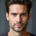 Image representing men's skincare, such as a clean-shaven face or a sleek, masculine product bottle.